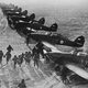 Pilots and crews from the Royal Canadian Air Force scramble to their Hurricanes to face incoming Luftwaffe aircraft. (RCAF)